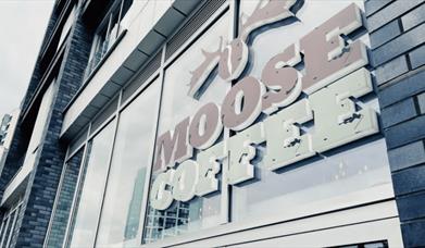 Moose Coffee sign on the outside of the building