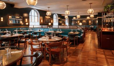 A restaurant venue with circle lights hanging from the ceiling.